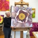 Mary Ahern in the studio with Subtle Exuberance - Tree Peony oil painting.