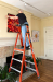 On a Ladder Hanging an Exhibition