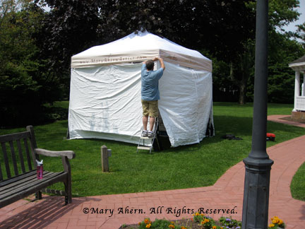 Side curtains are attached to the frame by a system of zippers and straps